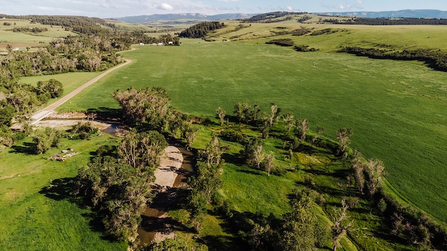 bird's eye view featuring a rural view and a mountain view