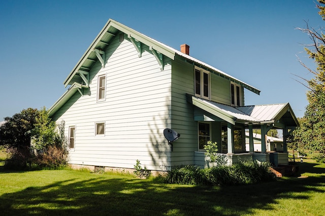 6058 Cottonwood Creek Rd, Lewistown, MT 59457 - view of side of home with a chimney and a lawn