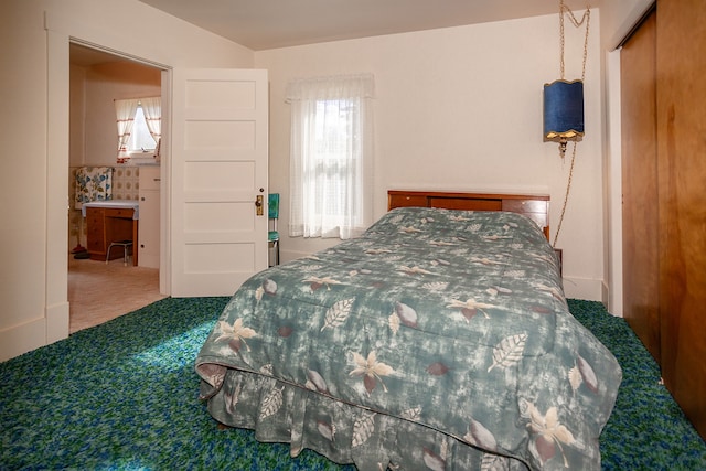 bedroom with a closet and carpet flooring