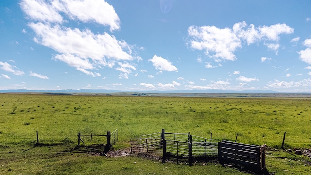 view of yard with a rural view