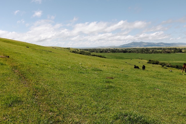 view of mountain feature with a rural view