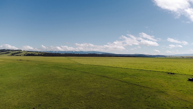 property view of mountains featuring a rural view