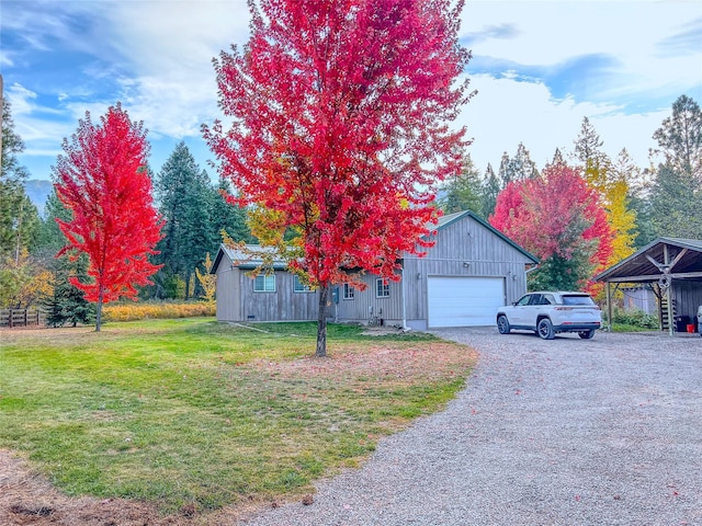 view of front of home featuring a garage and a front lawn