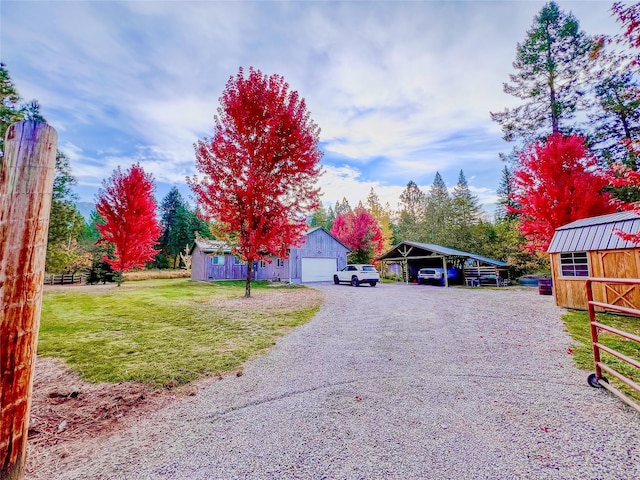 view of road featuring driveway and a gated entry