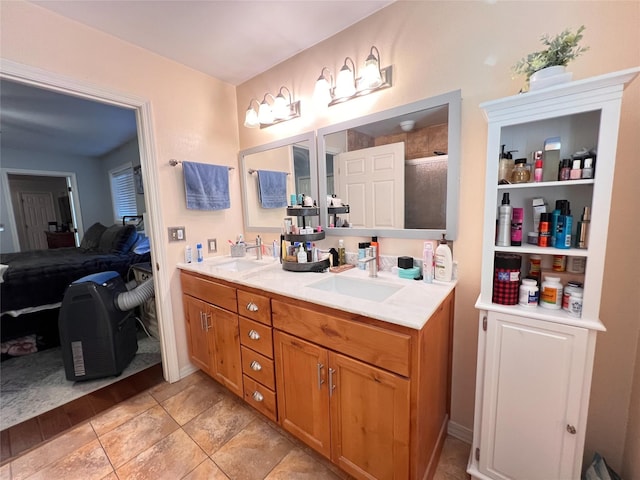 bathroom featuring vanity and an enclosed shower