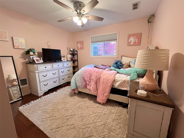 bedroom featuring wood-type flooring and ceiling fan