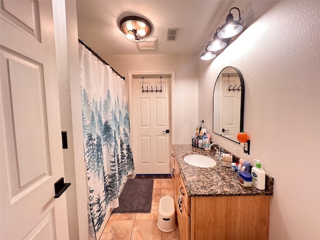 bathroom with vanity and tile patterned floors