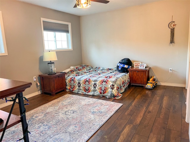 bedroom featuring dark hardwood / wood-style floors and ceiling fan