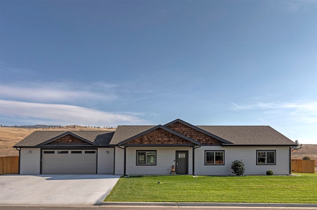 ranch-style house with a front lawn and a garage