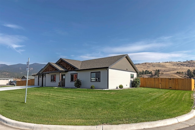 single story home featuring a front yard and a mountain view