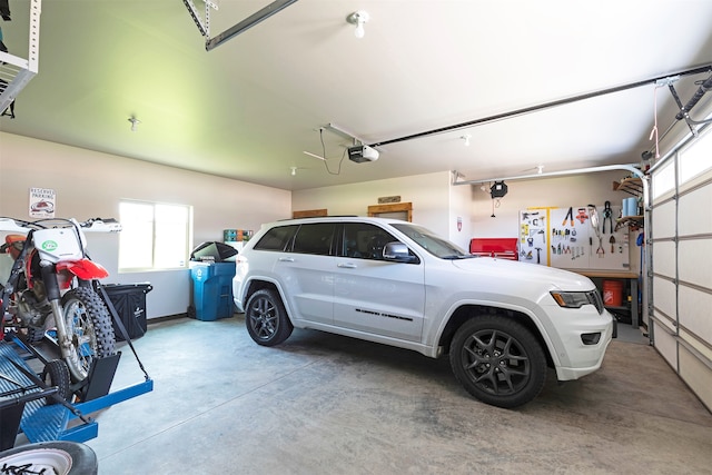 garage featuring a garage door opener