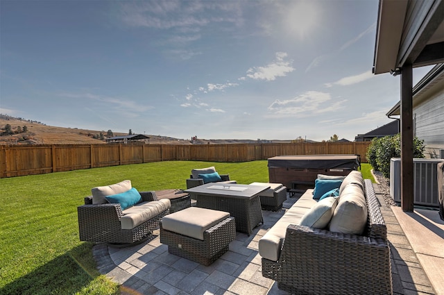 view of patio / terrace with an outdoor hangout area and a hot tub