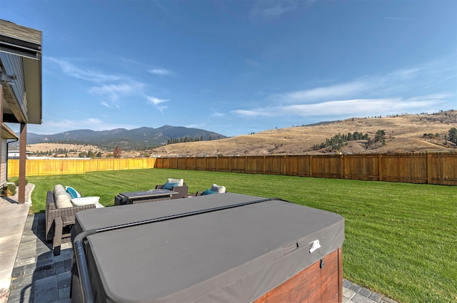 view of yard with a mountain view and a patio area