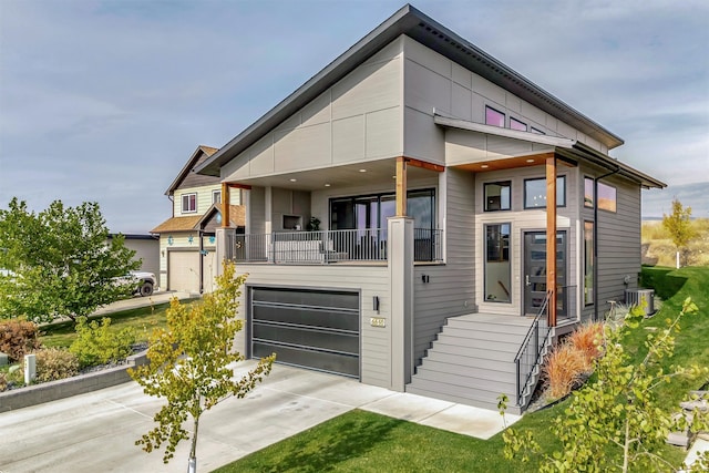 view of front of house featuring a garage and central AC