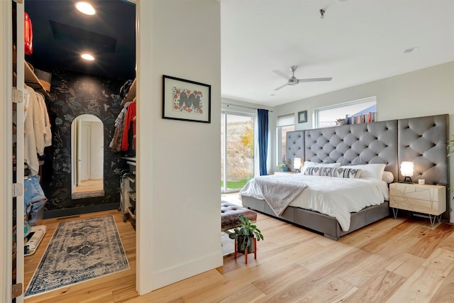 bedroom featuring ceiling fan and light wood-type flooring