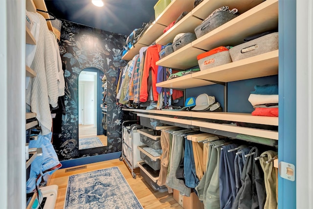 walk in closet featuring light hardwood / wood-style floors