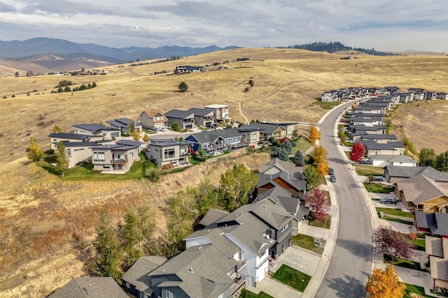 birds eye view of property with a mountain view