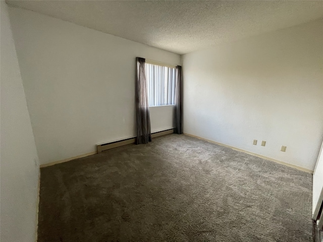 carpeted empty room featuring a textured ceiling and baseboard heating