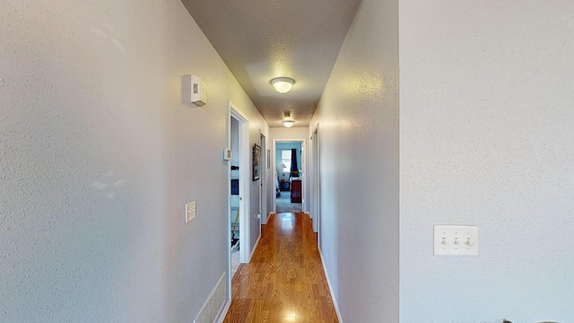 52772 Herak Rd, Charlo, MT 59824 - hallway with baseboards and wood finished floors