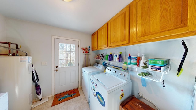 52772 Herak Rd, Charlo, MT 59824 - clothes washing area with separate washer and dryer, electric water heater, and cabinet space