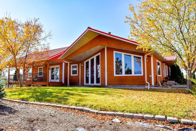 52772 Herak Rd, Charlo, MT 59824 - view of front of house with a front yard, french doors, and metal roof