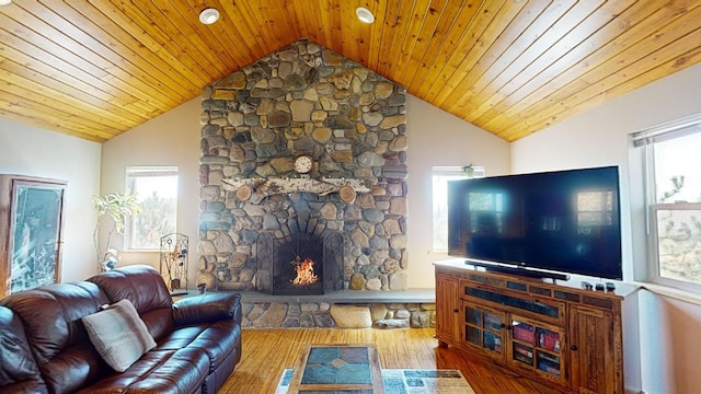52772 Herak Rd, Charlo, MT 59824 - living area featuring vaulted ceiling, wood finished floors, and plenty of natural light