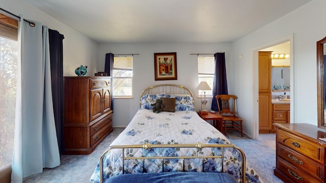 52772 Herak Rd, Charlo, MT 59824 - carpeted bedroom featuring connected bathroom and multiple windows
