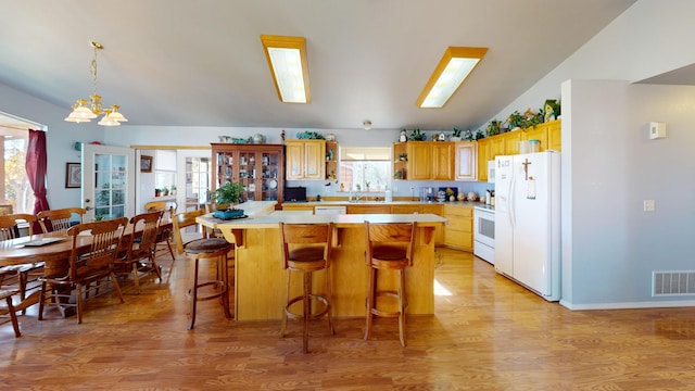 52772 Herak Rd, Charlo, MT 59824 - kitchen featuring light wood-style flooring, visible vents, white appliances, open shelves, and light countertops