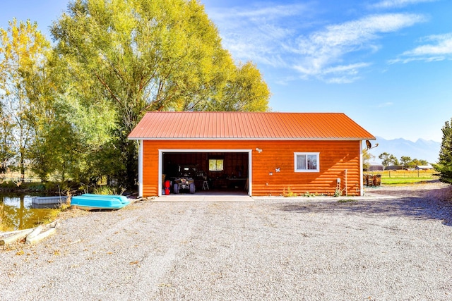 52772 Herak Rd, Charlo, MT 59824 - garage with driveway and a mountain view