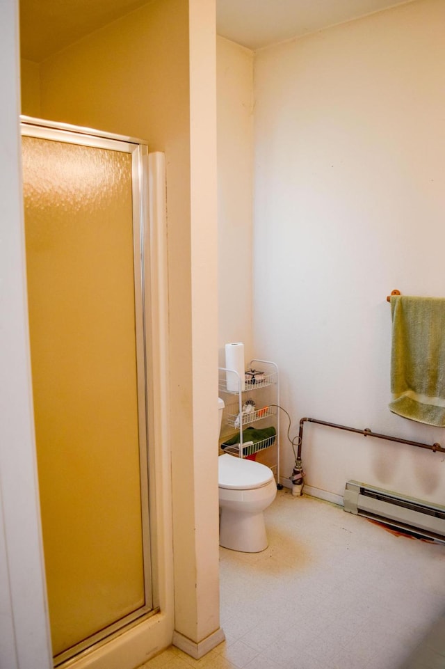 52772 Herak Rd, Charlo, MT 59824 - full bath with a baseboard radiator, a shower stall, and toilet