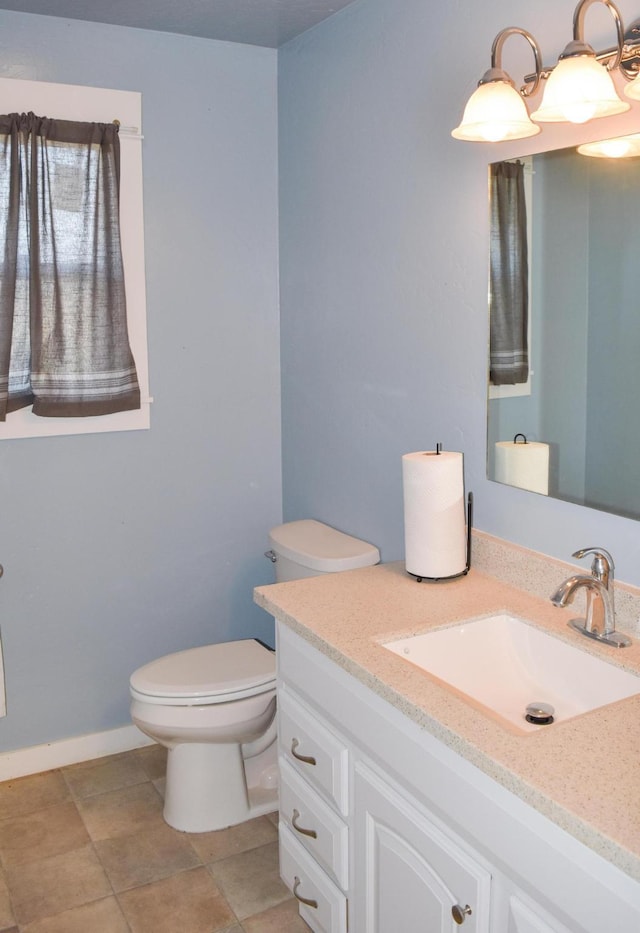 52772 Herak Rd, Charlo, MT 59824 - half bathroom with baseboards, toilet, and vanity