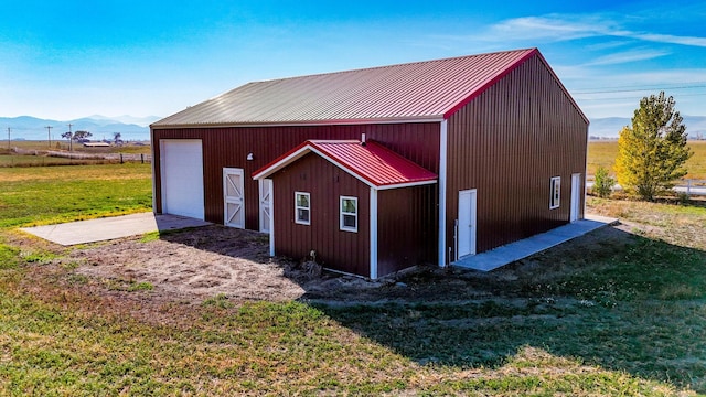 52772 Herak Rd, Charlo, MT 59824 - view of pole building with a lawn and a mountain view