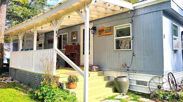 view of side of property with covered porch