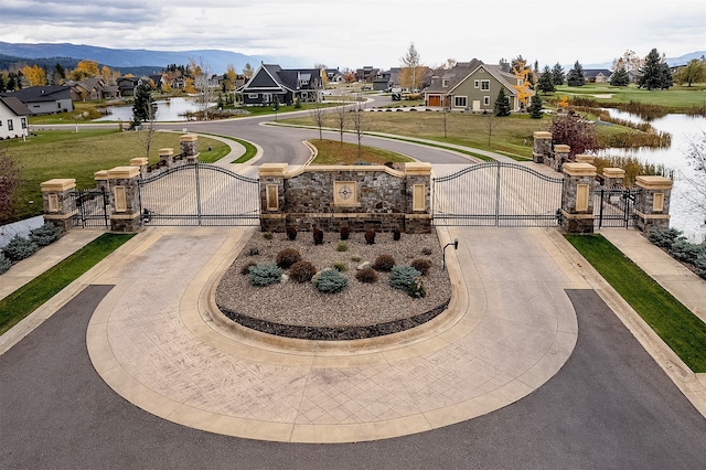 view of home's community with a water and mountain view