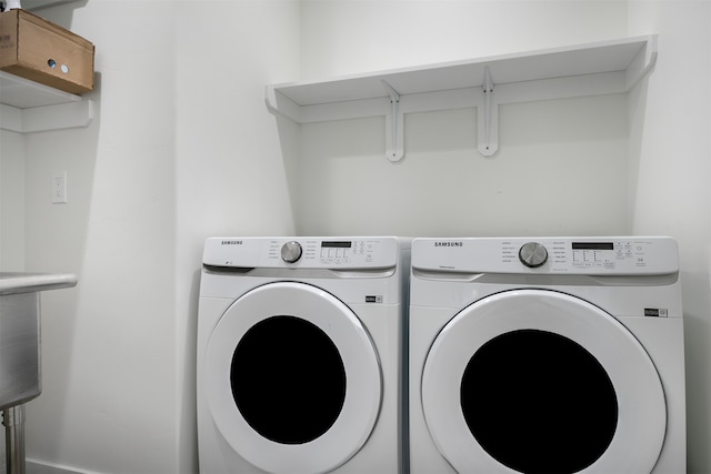 laundry area featuring washing machine and dryer