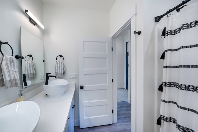 bathroom featuring vanity, a shower with curtain, and wood-type flooring