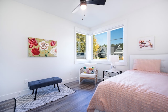 bedroom with dark wood-type flooring and ceiling fan