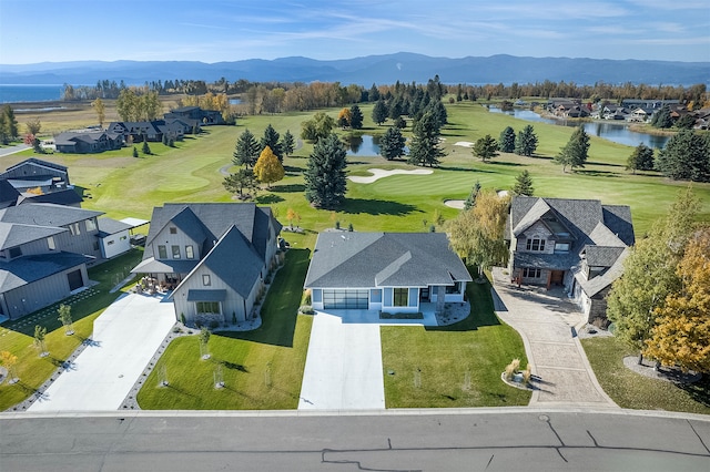 aerial view featuring a water and mountain view