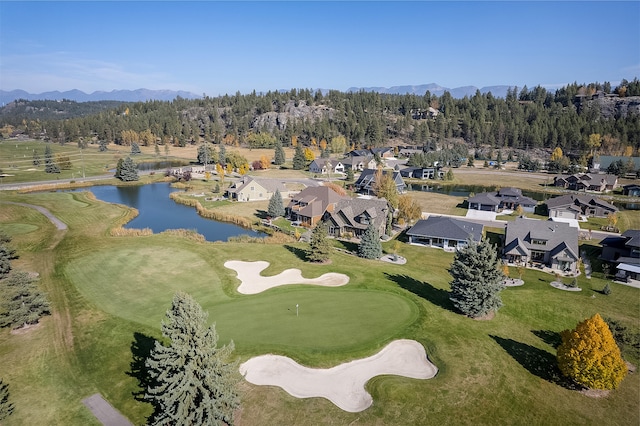 drone / aerial view featuring a water and mountain view