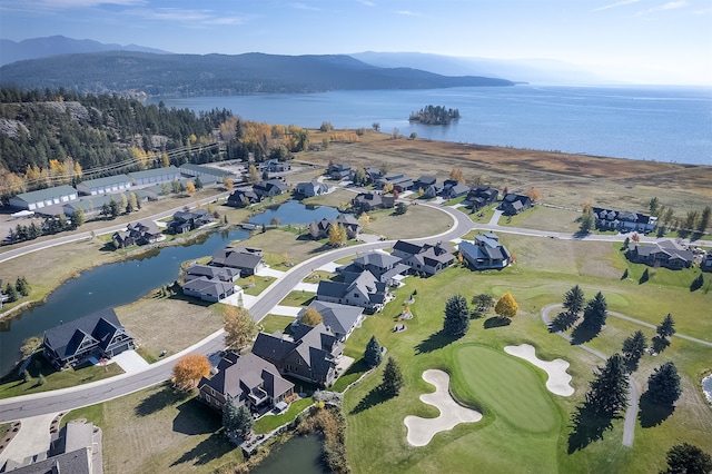 bird's eye view with a water and mountain view