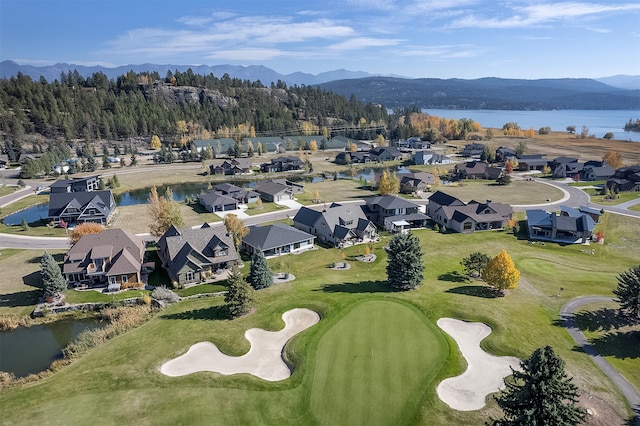 aerial view featuring a water and mountain view