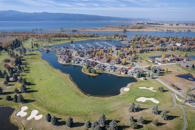 drone / aerial view featuring a water and mountain view