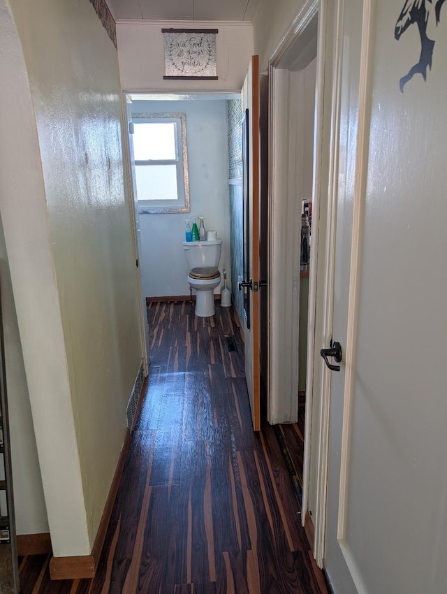 corridor featuring dark hardwood / wood-style floors