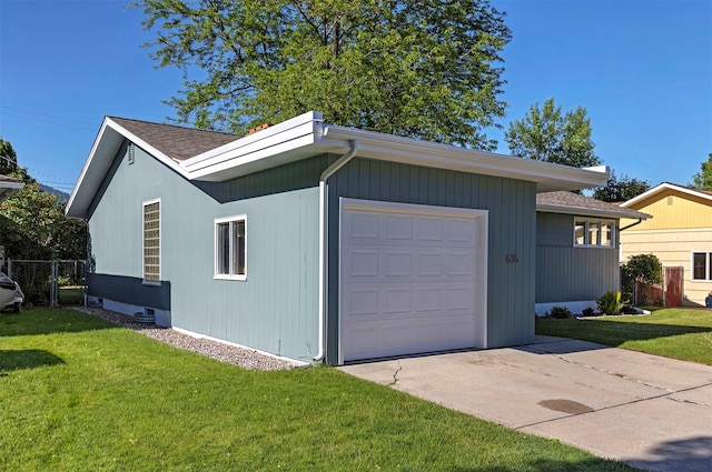 exterior space featuring wood walls and a lawn