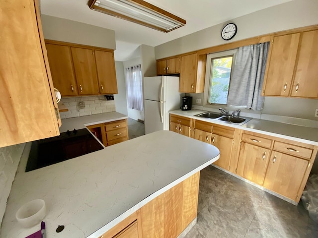 414 2nd St W, Chester, MT 59522 - kitchen with freestanding refrigerator, a sink, light countertops, and tasteful backsplash