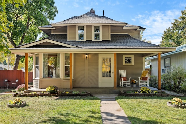 bungalow-style home with a porch and a front yard