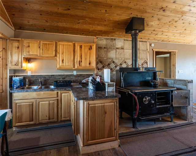 kitchen featuring decorative backsplash, wood ceiling, sink, and a wood stove