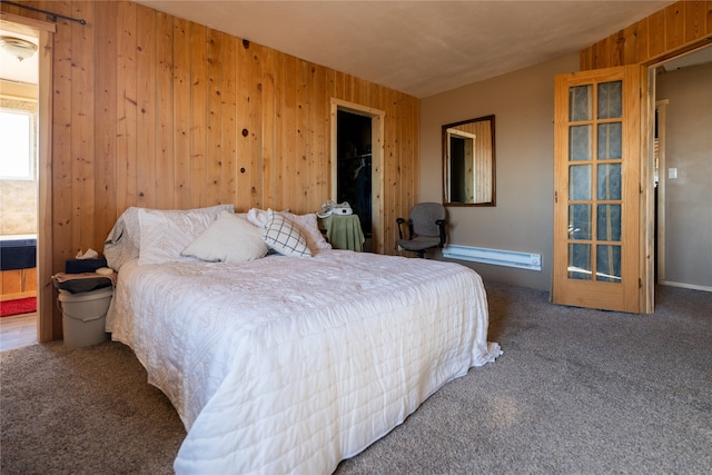 bedroom featuring carpet floors, wooden walls, and a closet