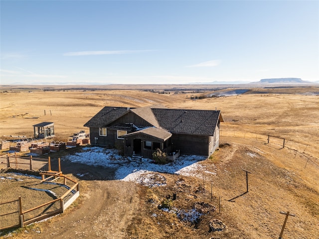 birds eye view of property featuring a mountain view and a rural view