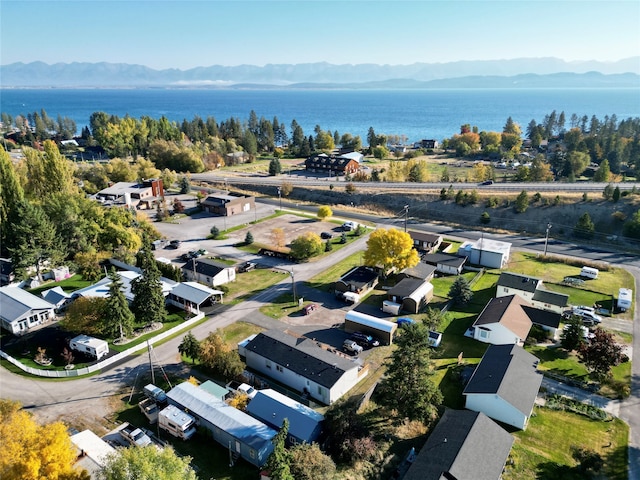 aerial view featuring a water and mountain view